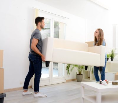 man-and-woman-moving-furniture-scaled